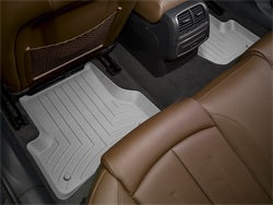 with 2nd row console requires trim marked on partGrey Rear FloorLiner Buick Enclave 2008 - 2010 Covers 2nd and 3rd row foot areas with 2nd row console requires trim marked on part